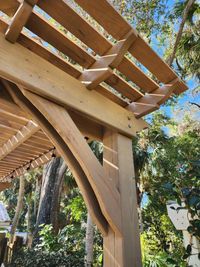 Close-up of a well-crafted pergola corner, demonstrating the quality woodworking skills of a leading Palm Bay, FL outdoor living construction business.