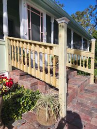 Traditional wooden railing with turned balusters, installed by Brevard County's renowned deck and outdoor structure construction experts.